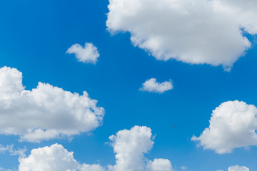 Wall Mural - blue clear sky with white fluffy clouds. natural background