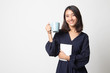 © halfbottle - Young Asian woman with a book and cup of coffee.