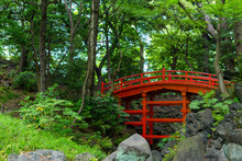 Beautiful Red Bridge In Koishikawa Botanical Gardens, Tokyo