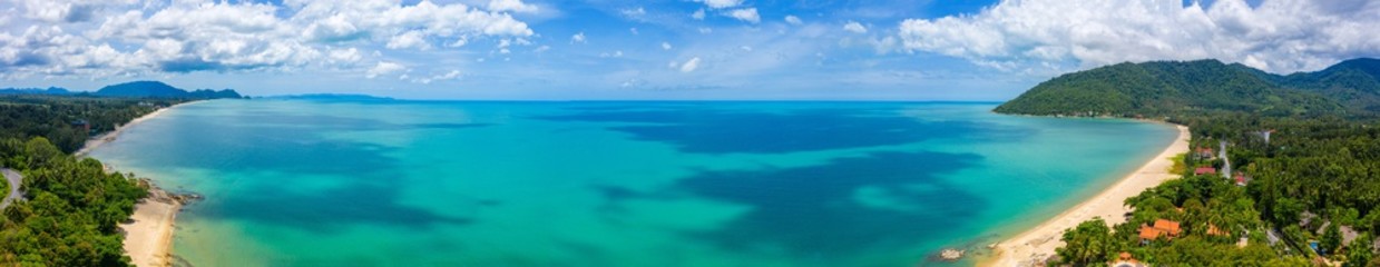 Aerial view image of sea, beache and jungle with blue  sky in Nakhon Si Thammarat, Thailand