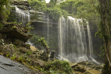  Man Fah waterfall after heavy rainfall in deep forest at Thap Lan National Park, Thailand.