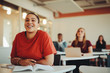 © Jacob Lund - Smiling female student sitting in university classroom