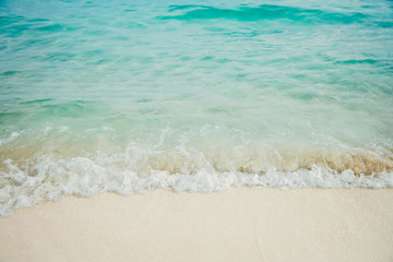 Wall Mural -  Blue sea ocean, water sun reflection, and sand background.