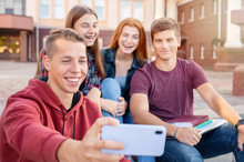 Happy Smiling Group Of Students Taking Picture On The Phone Outdoors Near University
