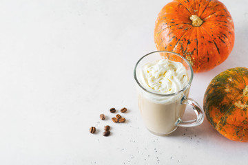 Wall Mural - Glass of pumpkin lattee coffee on white background