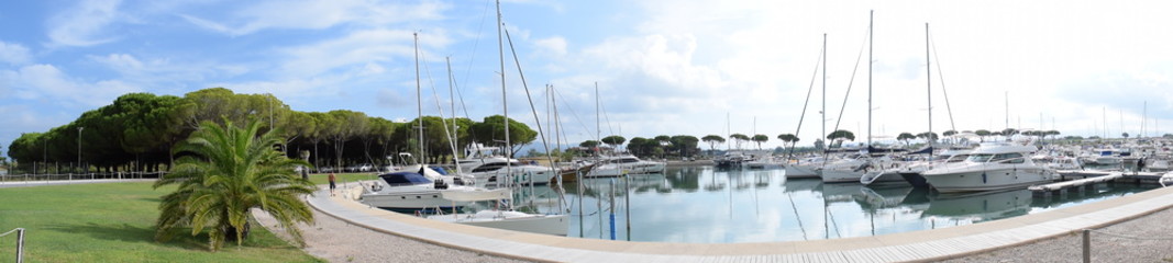 Cecina, Italy - August 17, 2020: The harbor of Marina di Cecina. Boats inside the port in a summer day.