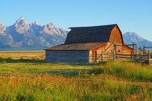 Sunrise Over Mormon Row In Grand Teton National Park With The Mountains In The Background In Wyoming, United States