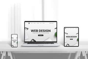 Leinwandbilder - Web design company web site promotion od different devices. White wooden desk with clean background