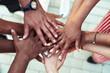 © etonastenka - Black people with hands joined. Group of people stacking hands together