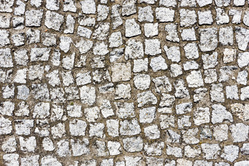 Sticker - Cobblestone pavement texture. Street blocks background. Gray rock mosaic cubes pattern. Vintage city sidewalk construction.