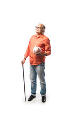 Indian senior adult or old man with piggy bank or money box