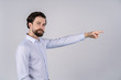 © Ivan - man in profile, look at camera, and show with finger at something, isolated on white background