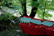 The iron bed is hanging on a tree in the forest for relaxation time. Hammock	
