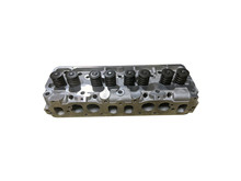 Car Engine Cylinder Head Isolated On White Background. New Spare Parts.