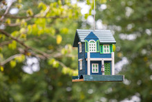 Decorative Bird House On Tree In Summer Park