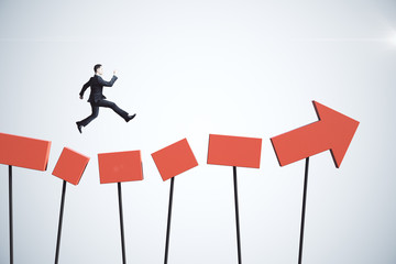 Poster - Businessman jumping on red arrow