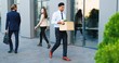 © VAKSMANV - Young sad Hindu man, white-collar worker walking the street and carrying box with stuff after being fired. Upset Office manager dismissed from work. Economic crisis of unemployment. Firing from job.