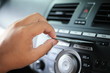 © Champ - Close up hand with cd player in car