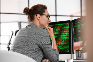 Female programmer working in office