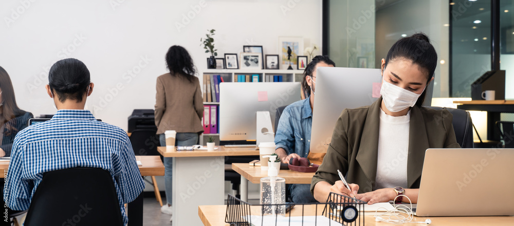 Asian business people working in office with new normal lifestyle. - obrazy, fototapety, plakaty 
