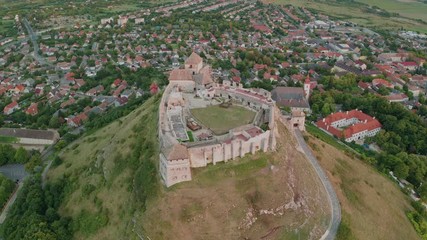 Wall Mural - Sumeg, Hungary - 4K drone flying around at the Castle of Sumeg by the town of Sumeg, Veszprém county on a summer afternoon with golden sunset at background