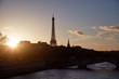 © astrosystem - Cityscape of Paris, France and famous landmark Eiffel tower in silhouette just before sunset.