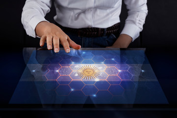 Poster - Business woman touching screen with Argentina flag