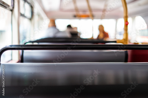 Fotomural The top deck of a London double decker bus, with soft focus