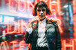© BullRun - Half length portrait of attractive Caucasian party girl posing near neon wall during night walk in New York, beautiful female tourist in trendy streetwear and stylish spectacles for vision correction