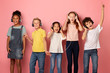 © Prostock-studio - Multiethnic schoolchildren in headphones listening to music or audio books over pink background