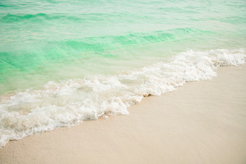 Wall Mural -  Blue sea ocean, water sun reflection, and sand background.