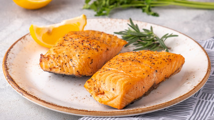 Wall Mural - Grilled fish with rosemary and lemon on a plate