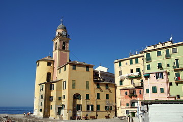 Wall Mural - Basilica Di Santa Maria Assunta in Camogli, Italy anchors this Italian Riviera resort town. This historic landmark is popular with tourists traveling on vacation.