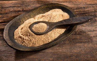 Sticker - Organic maca powder in the wooden bowl - Lepidium meyenii.