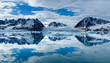 Norway, Svalbard, Spitsbergen. Monacobreen Glacier and mountain reflections.