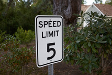 5 Mph Speed Limit Sign In A Neighborhood Parking Lot.