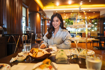 Young woman eating in the restaurant