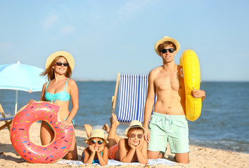 Poster - Happy family on sea beach at resort