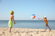 © New Africa - Cute little children playing with inflatable ball on sandy beach