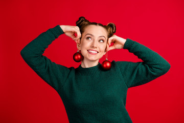 Sticker - Close-up portrait of her she nice attractive pretty funky cheerful cheery girl holding in hands festive toys like earrings having fun isolated bright vivid shine vibrant red color background