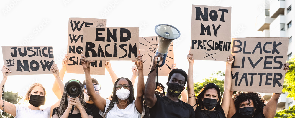 Activist movement protesting against racism and fighting for equality - Demonstrators from different cultures and race protest on street for equal rights - Black lives matter protests city concept - obrazy, fototapety, plakaty 