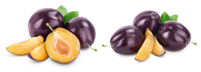 fresh purple plum and slices with leaves isolated on white background with clipping path and full depth of field. Set or collection