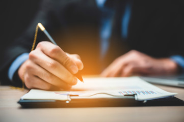 Close up business man signing contract making a deal, classic business success concept