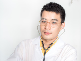 Smart asian professional doctor holding with a stethoscope