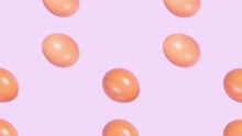 Stop Motion Brown Chicken Eggs Falling Down On Purple Background