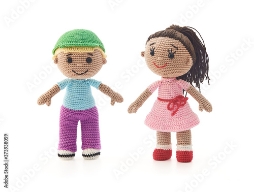 Knitted toys boy and girl on a white background © Andrey Zyk