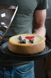 © Maria - Cheesecake in man hands. Homemade cheesecake. New York style cream cheese cake