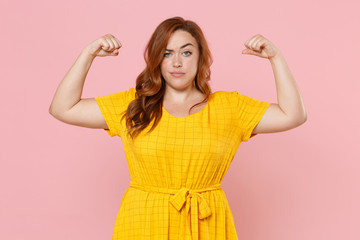 strong perplexed young redhead plus size body positive female woman girl 20s in yellow dress posing 