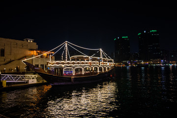 Night view of cruise ship in abra, January 2020, Dubai, U.A.E. 