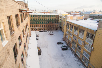 The courtyard of an old Soviet factory covered with snow